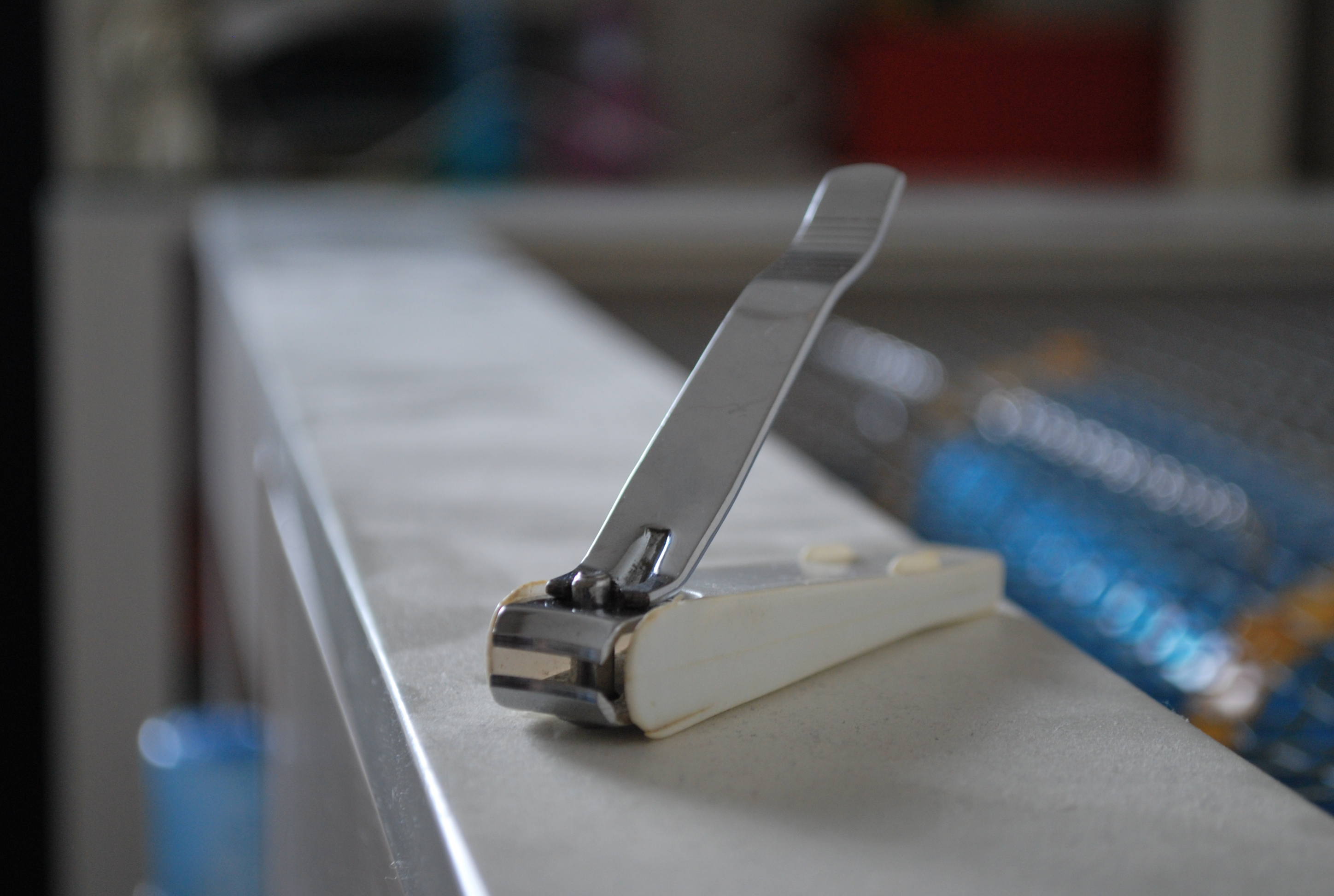 A nail cutter on a plain surface