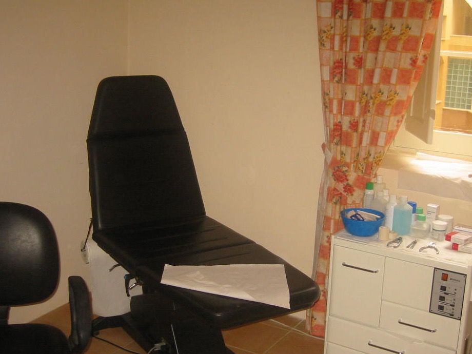 A podiatry treatment chair and clinical foot care equipment
