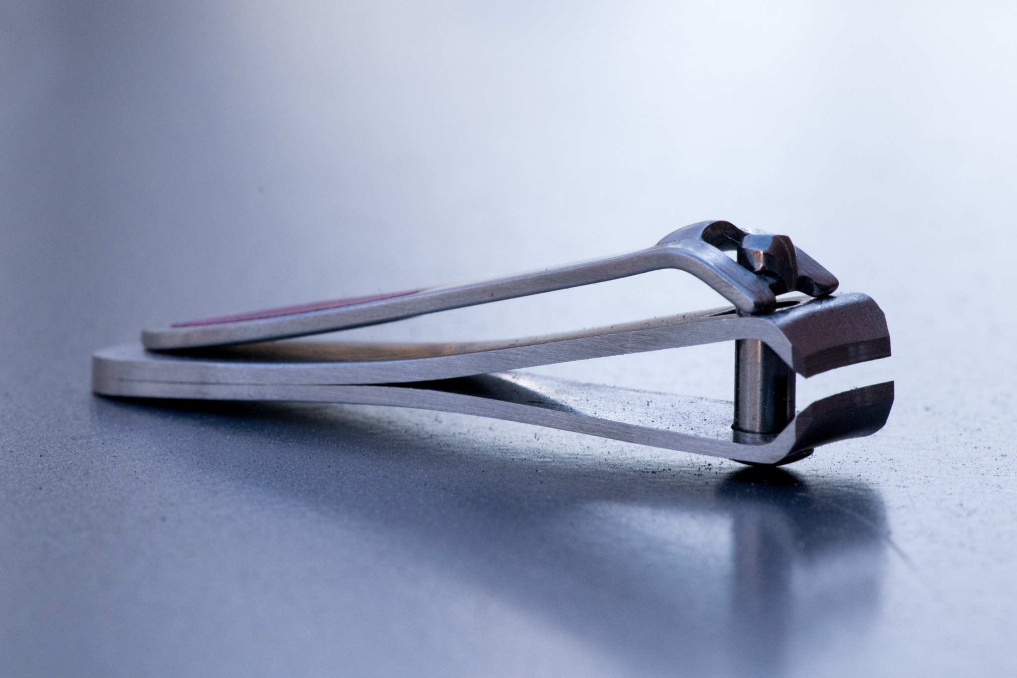 Nail clippers on a plain surface, showing why ordinary tools may not be enough for difficult nails