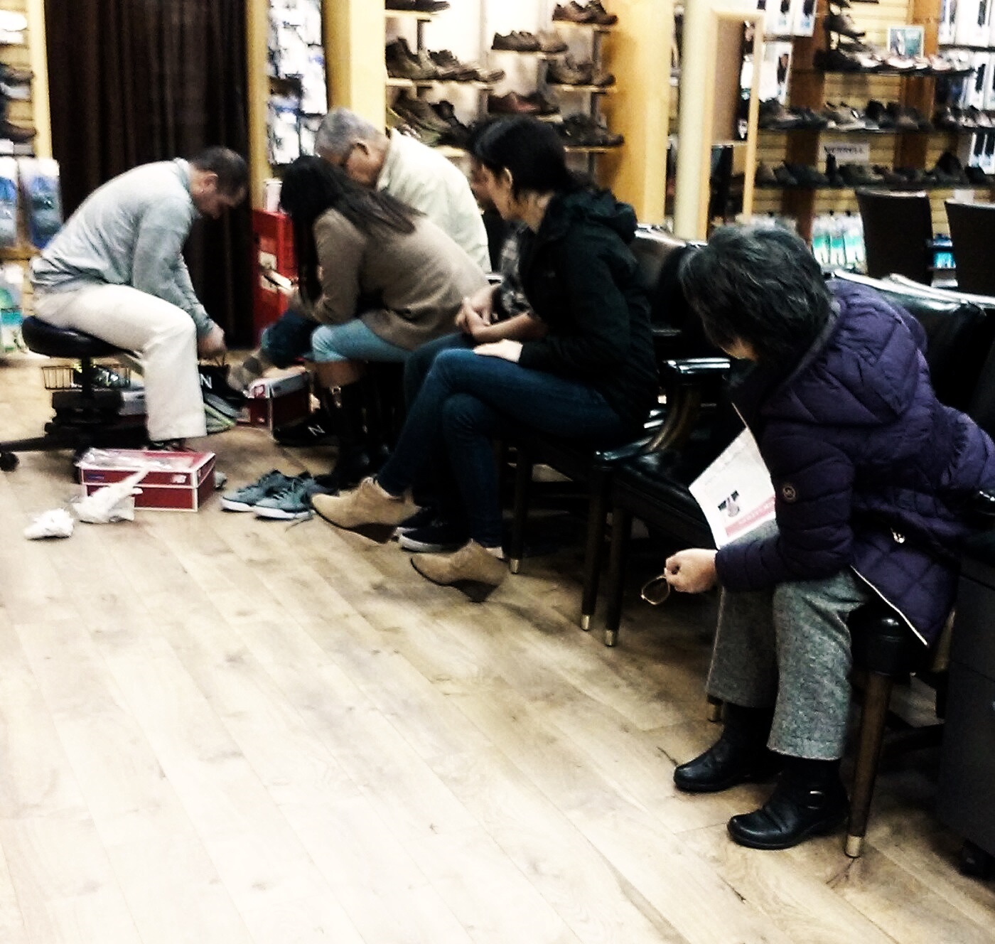 A shoe fitting scene showing why footwear fit can affect pressure on the feet