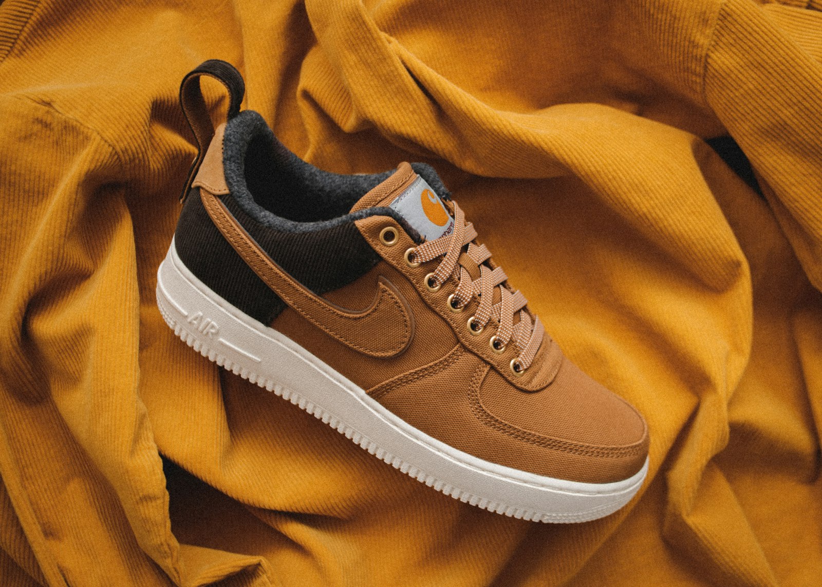 A pair of casual shoes showing the toe area that can press on toes