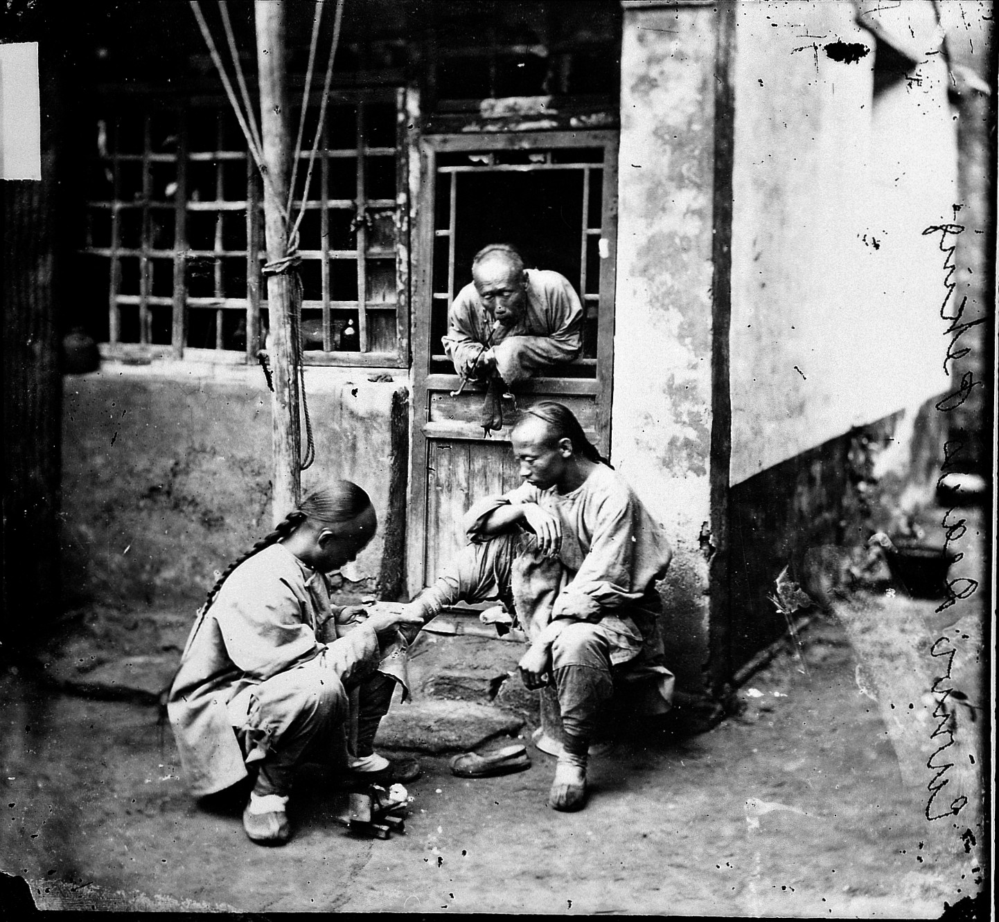 Historical image of a travelling chiropodist treating a patient