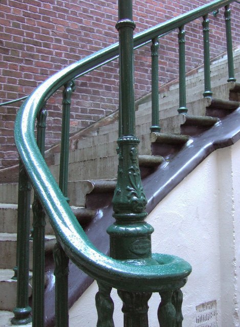 A handrail beside outdoor steps showing why rails and stair safety matter