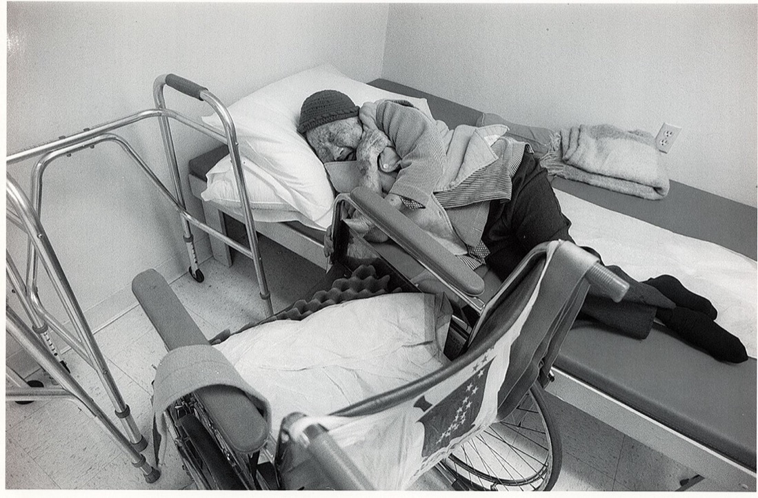 An older adult sitting at home while care is being planned around daily needs