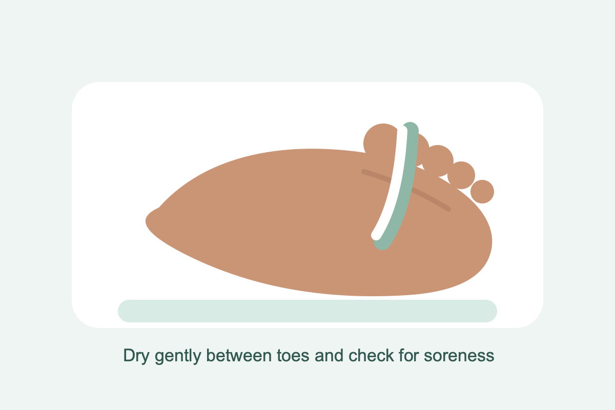 A towel being used gently to dry between toes during a foot check