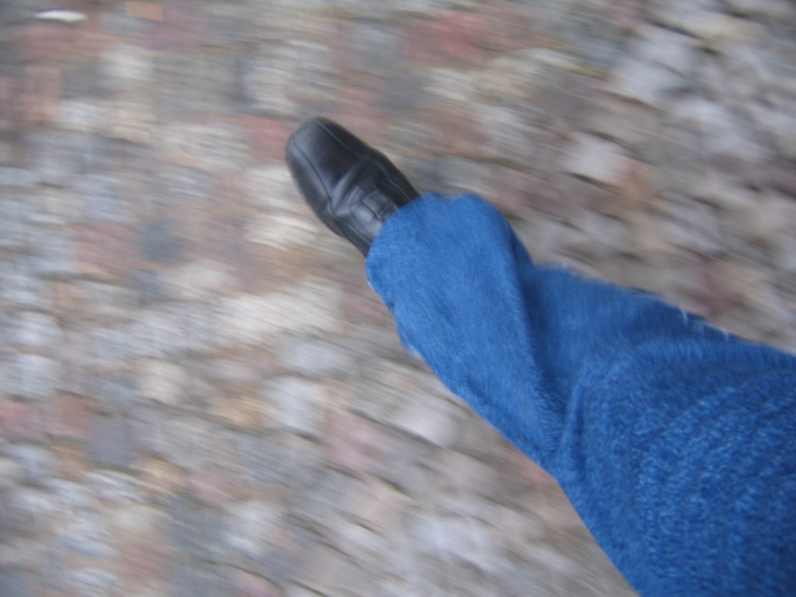 Feet in shoes while walking, used to show how pressure can make a corn painful