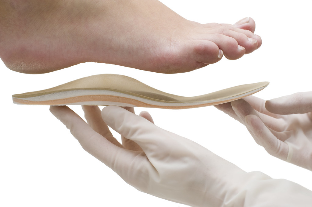 A foot care professional preparing tools for safe nail care