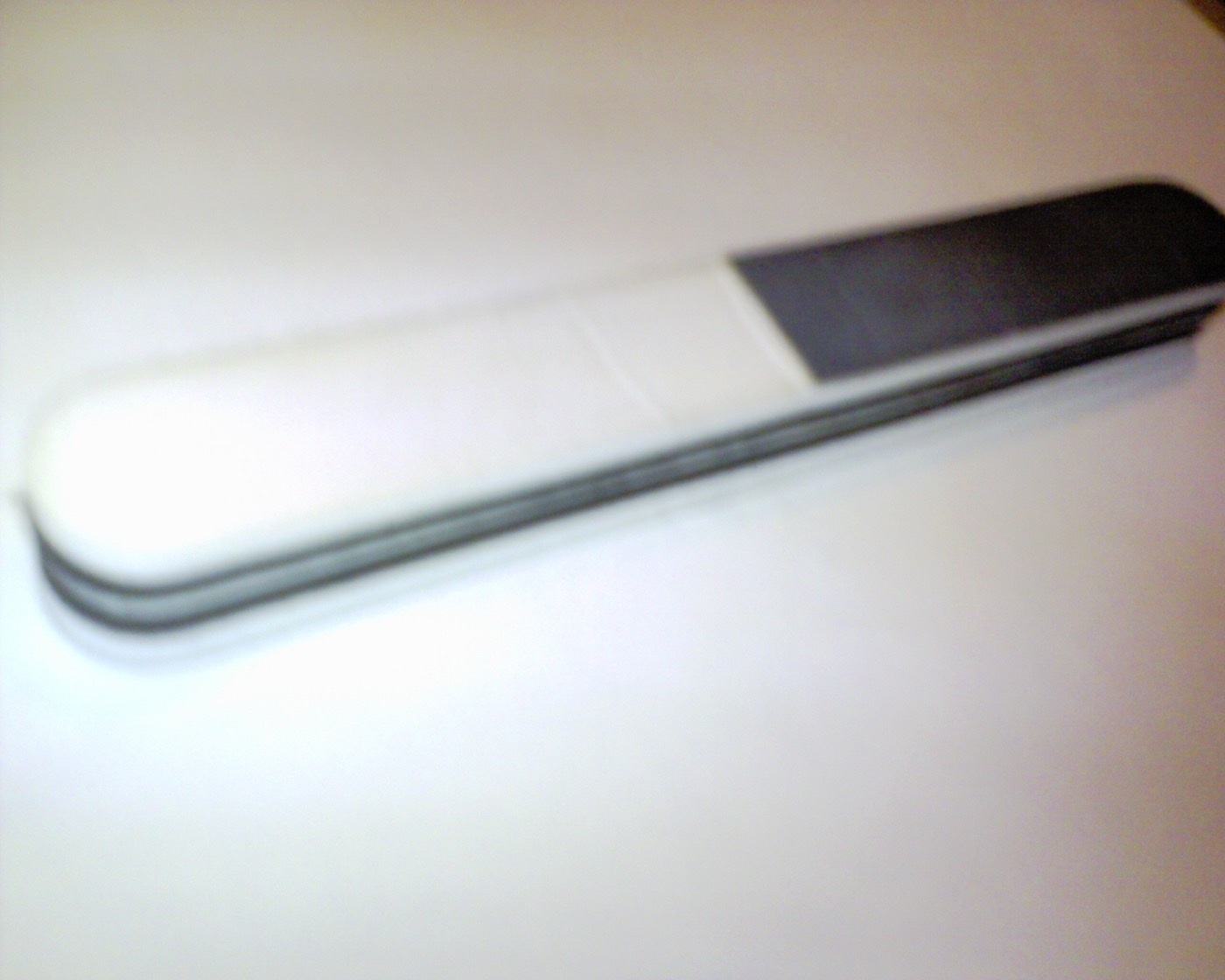 A nail file on a neutral background