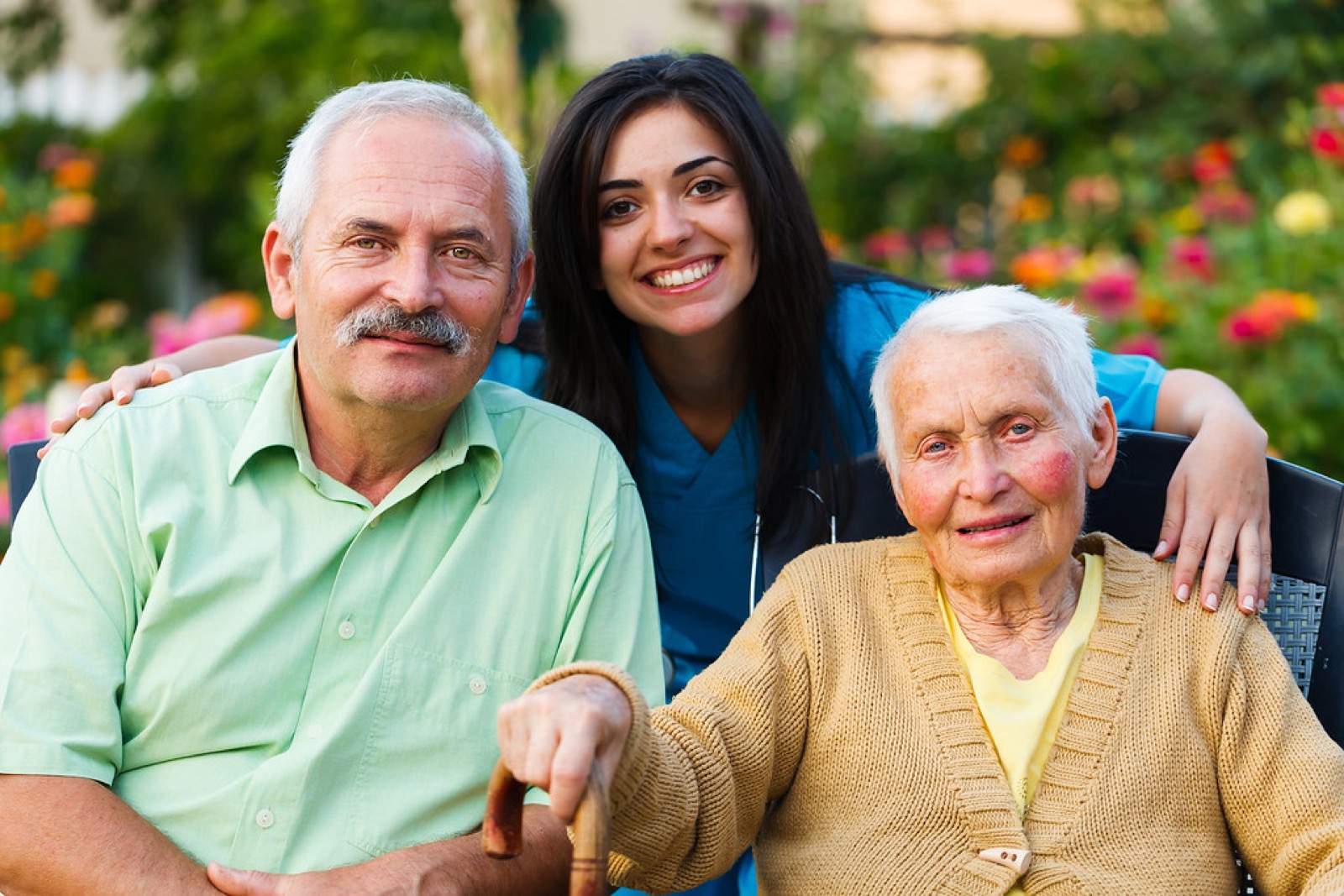 A care professional speaking with an older person during a visit