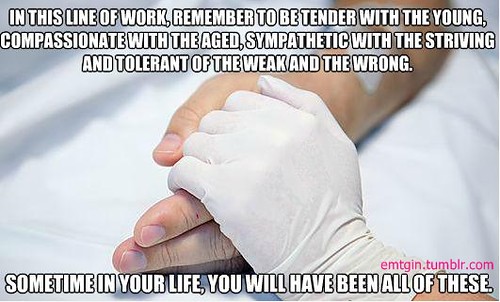 A care worker holding an older person’s hand